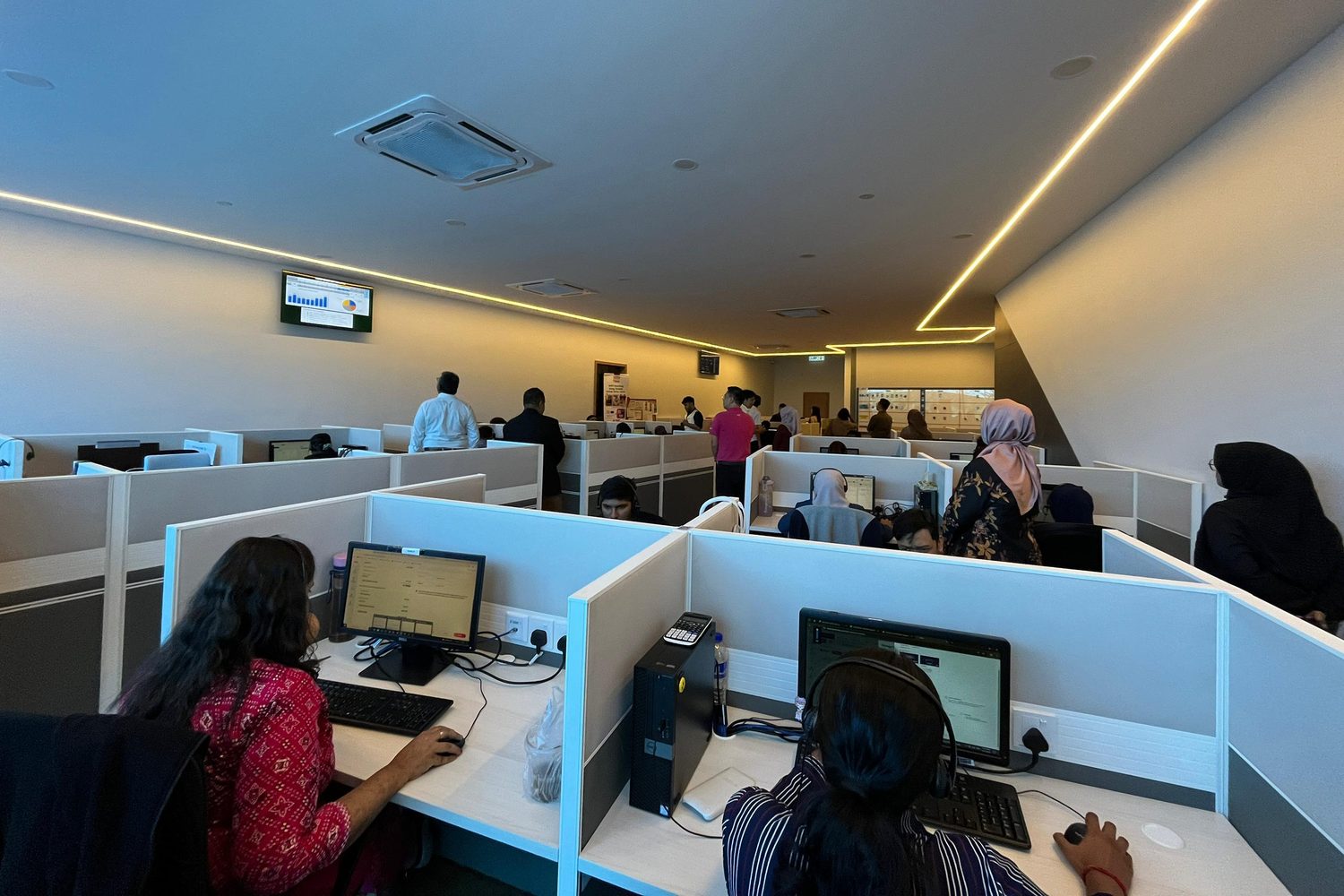 Agents at their workstations on the new contact centre floor